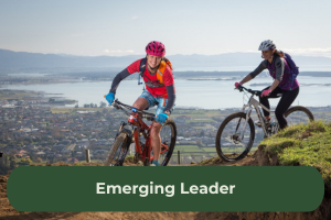 Two women cycle along the top of the Port Hills in Christchurch