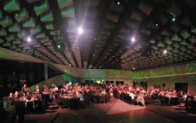 An image of an awards ceremony in Te Pae, Christchurch, a group of people sit at tables in a room