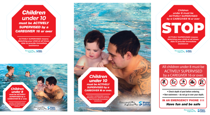 A dad and his son are in a pool