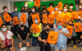 group Photo everyone in orange t-shirts